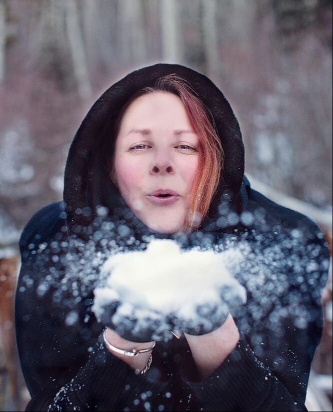Photo of Urban Dweller editor, Karen Pellegrin, blowing snow at the camera